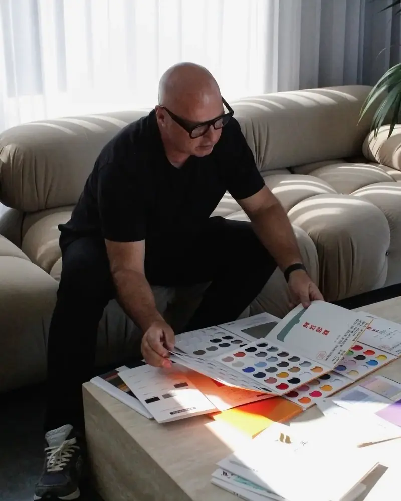 Armour founder Michael reviewing fabric colour swatches